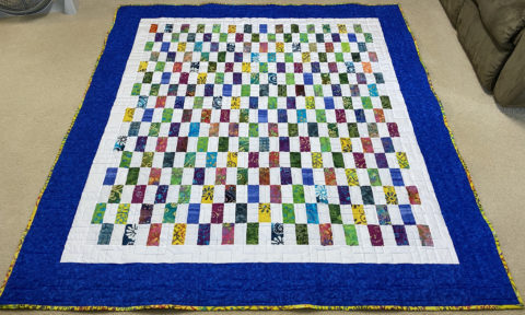 Patti’s Batik Strip Patch Quilt