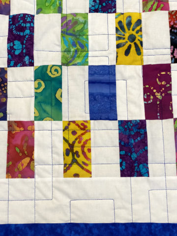 Patti’s Batik Strip Patch Quilt