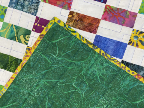 Patti’s Batik Strip Patch Quilt