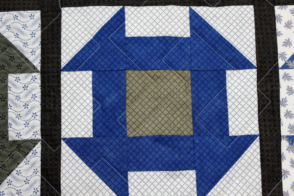 Laverne’s Brown and Blues Churn Dash Quilt