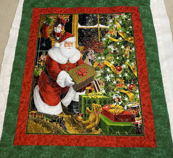 Patsy’s Quilted Santa Delivering Presents
